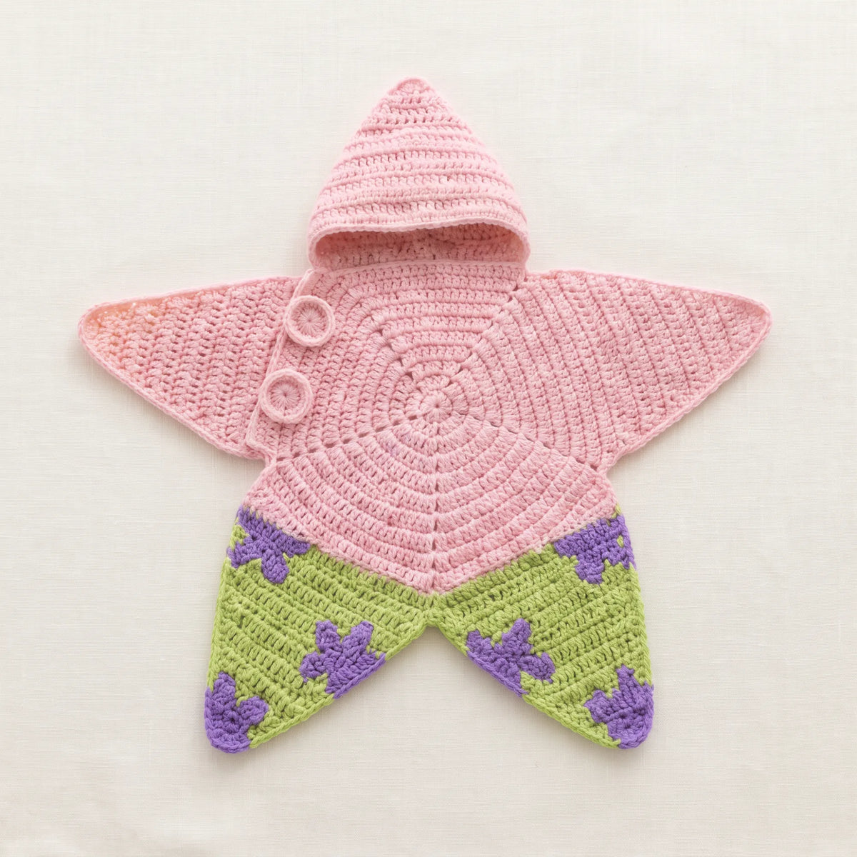 Pyjama Étoilé en crochet rose et vert à motifs étoiles violettes, avec capuche
